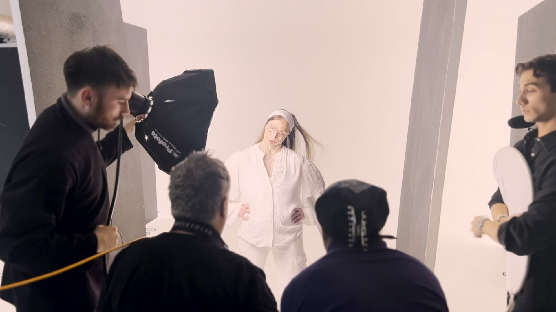 A behind the scenes photograph of Patricia, an acid attack survivor , having the portrait taken by Rankin the photgrapher